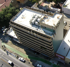 Aerial view of a new commercial roof on Guadalupe