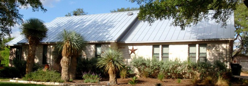 House after standing seam roof installation