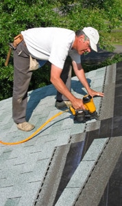 man working on a roof