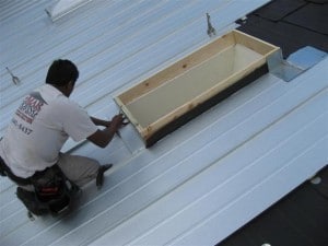 Man working on metal roofs